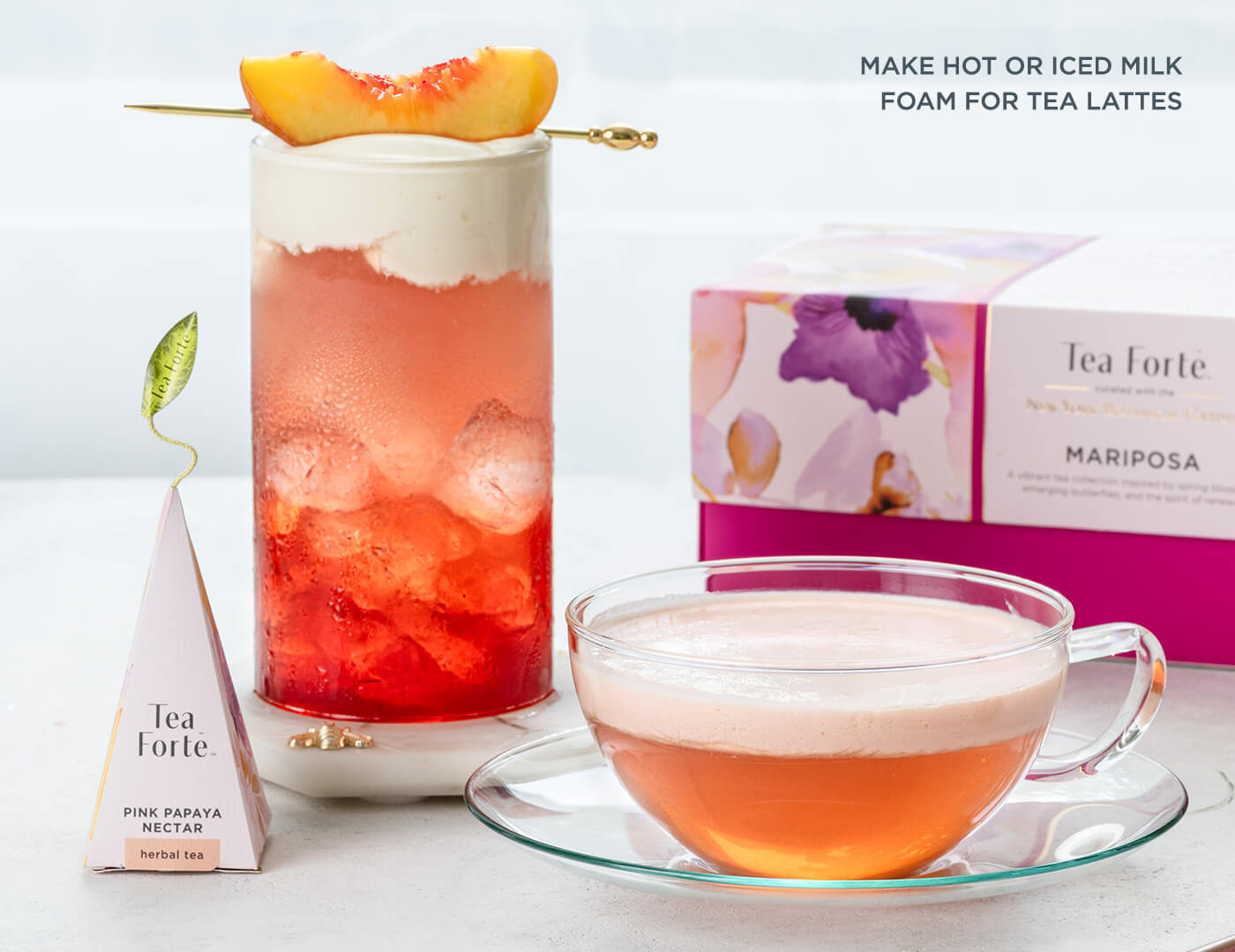Tea Forté Pink Papaya Nectar tea lattes and pyramid infuser on a white background.