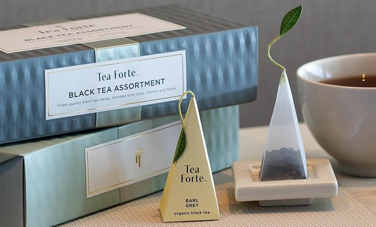 Black tea assortment in a 10 count petite presentation box on table