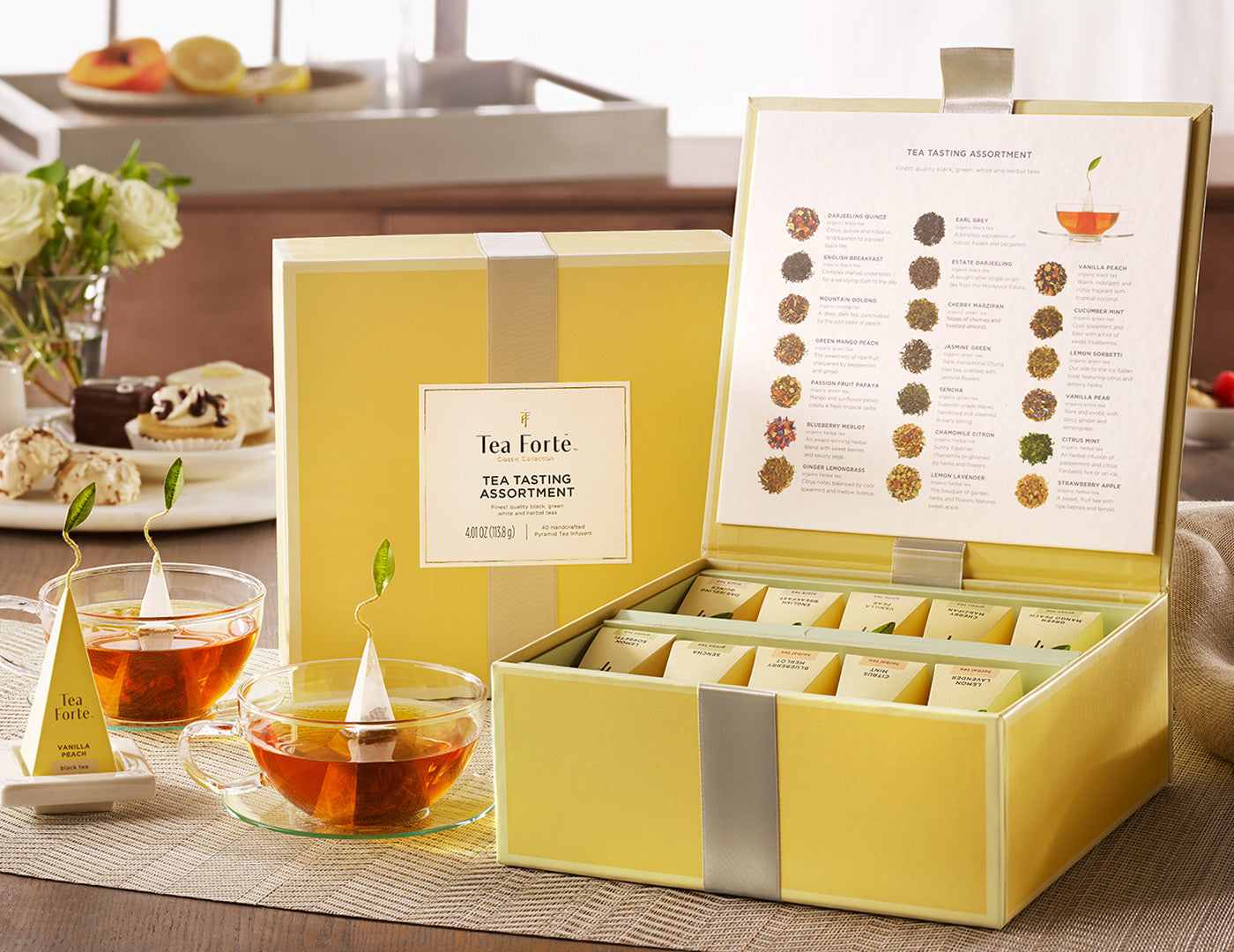 Tea Tasting tea assortment in a 40 count tea chest of pyramid infusers on table