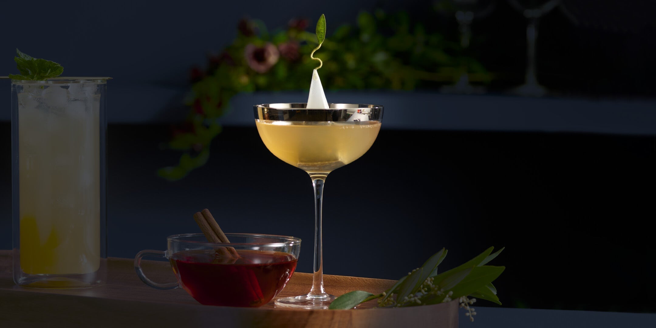 Earl Grey Classic French 75 cocktail on a dark background with other cocktails