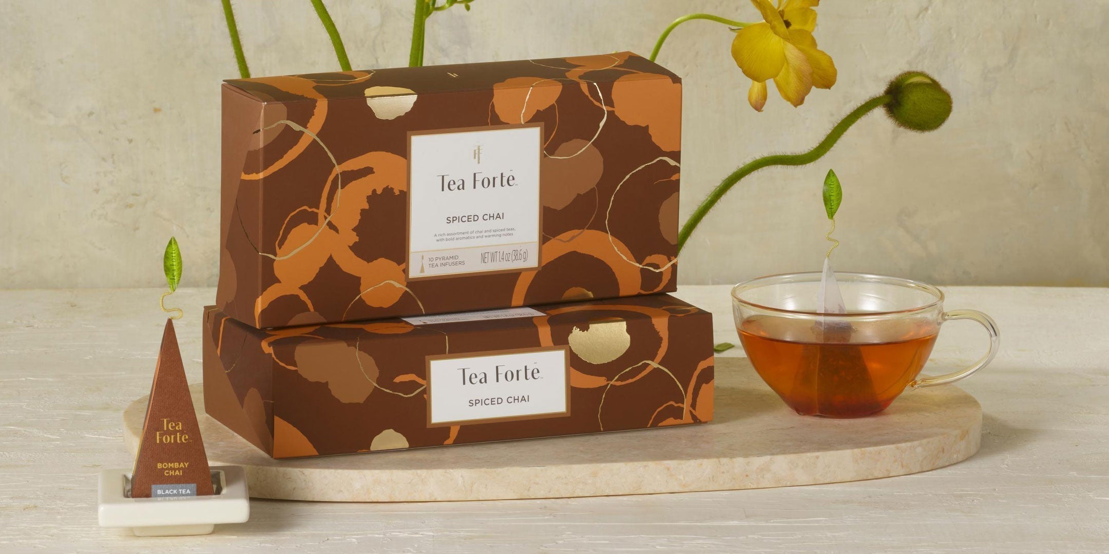 Spiced Chai Collection, Petite Boxes stacked with flowers and a glass of tea