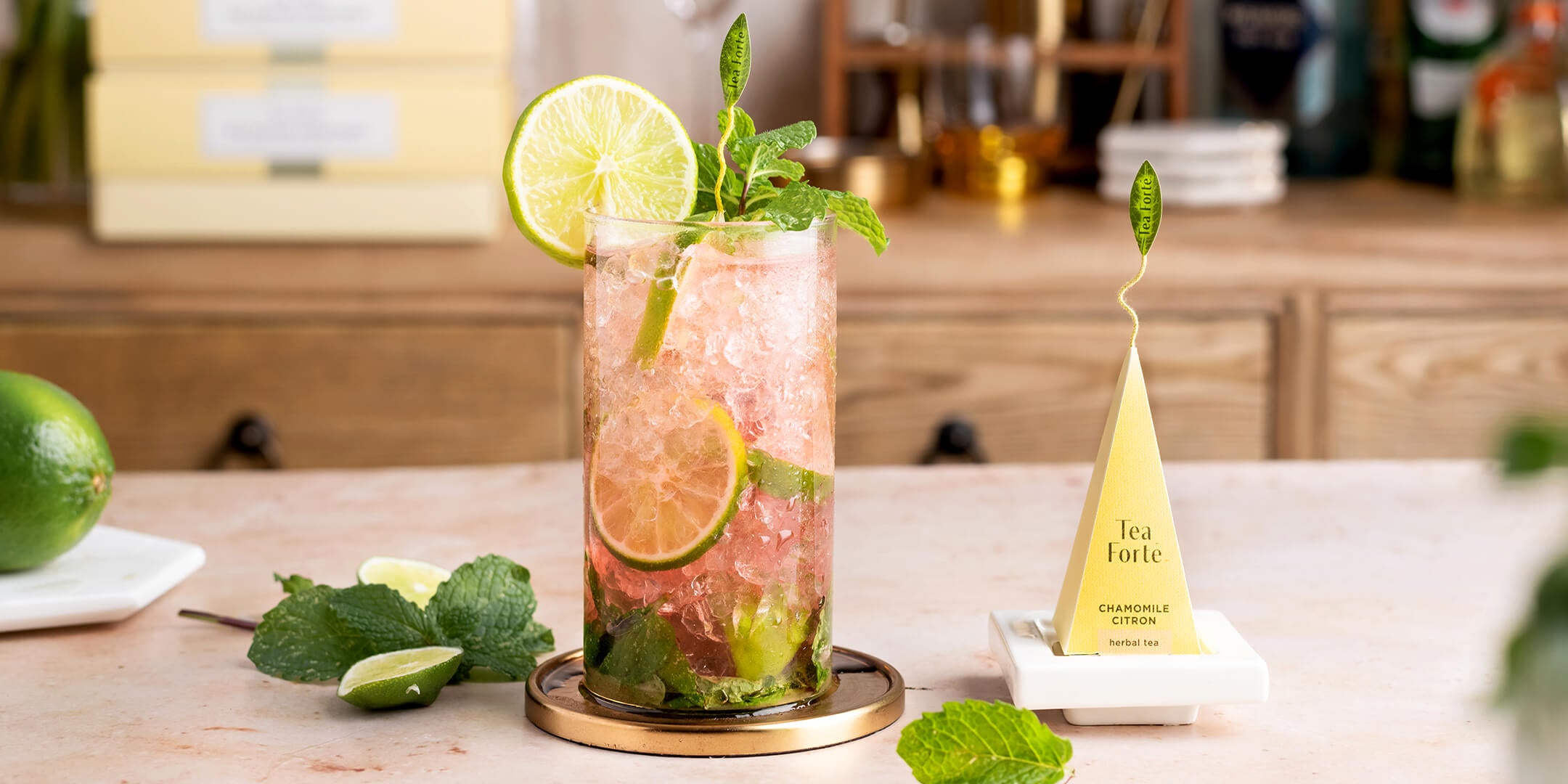 Chamomile Citron Mojito Mocktail with infuser on a tea tray