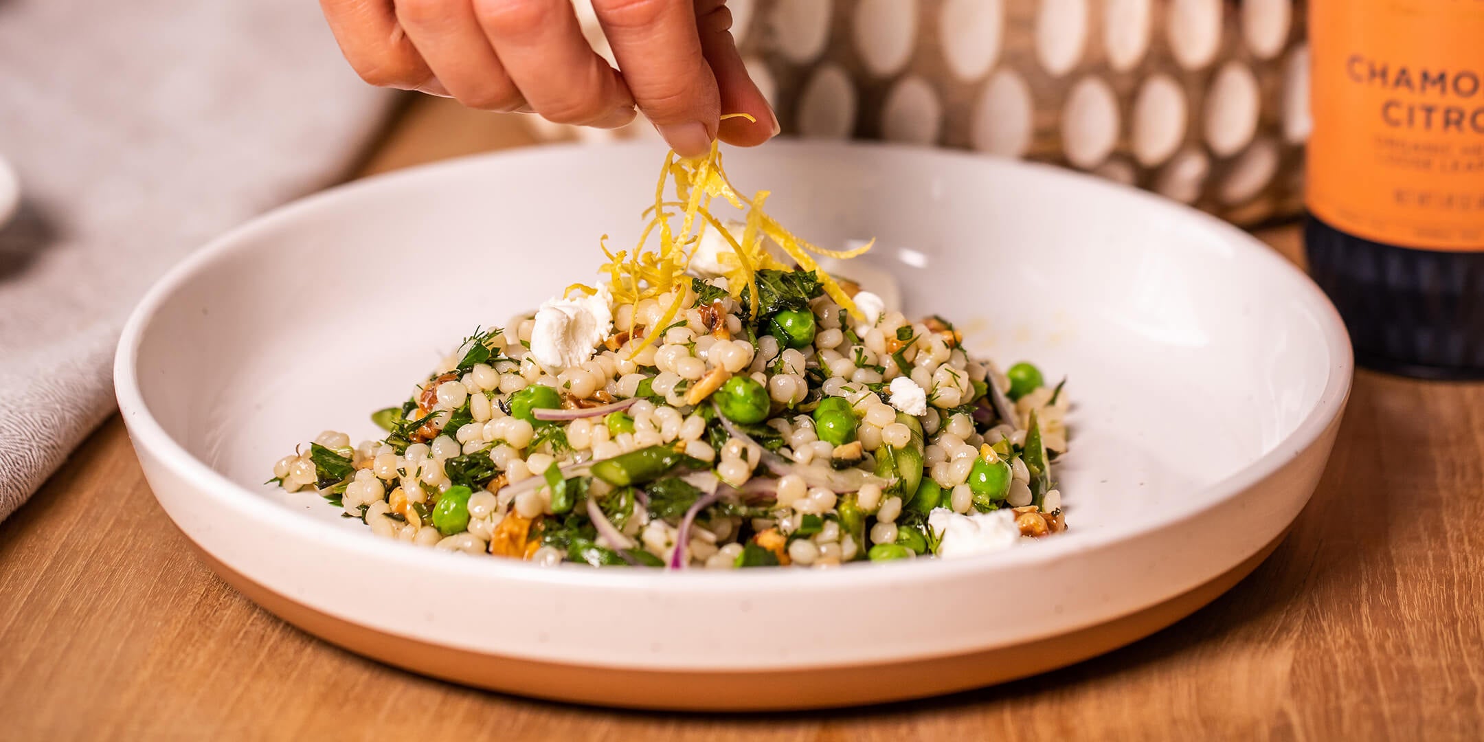 Chamomile Citron Couscous Salad in a white bowl