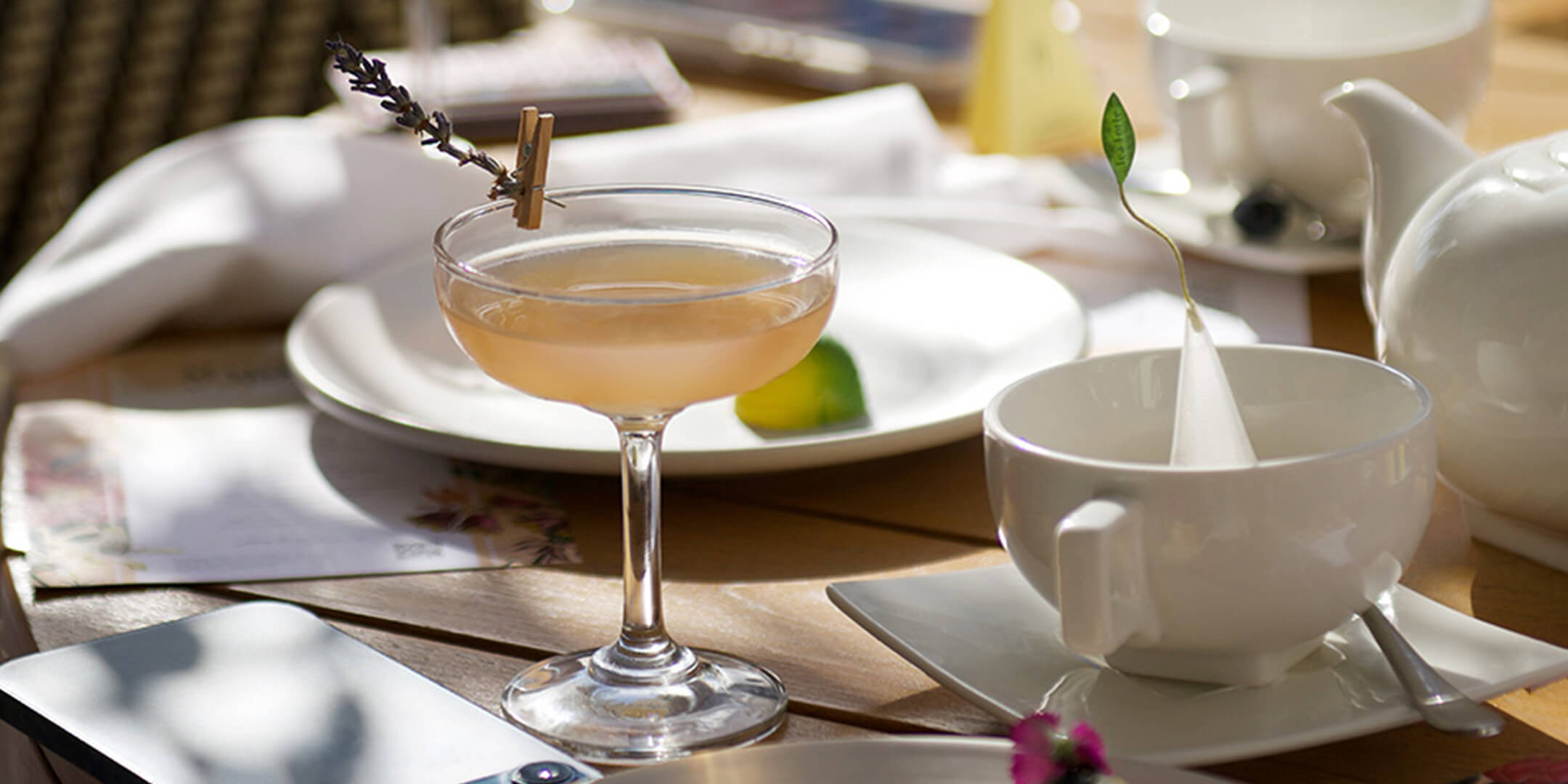 Tea martini on a table with other dishes and glasses