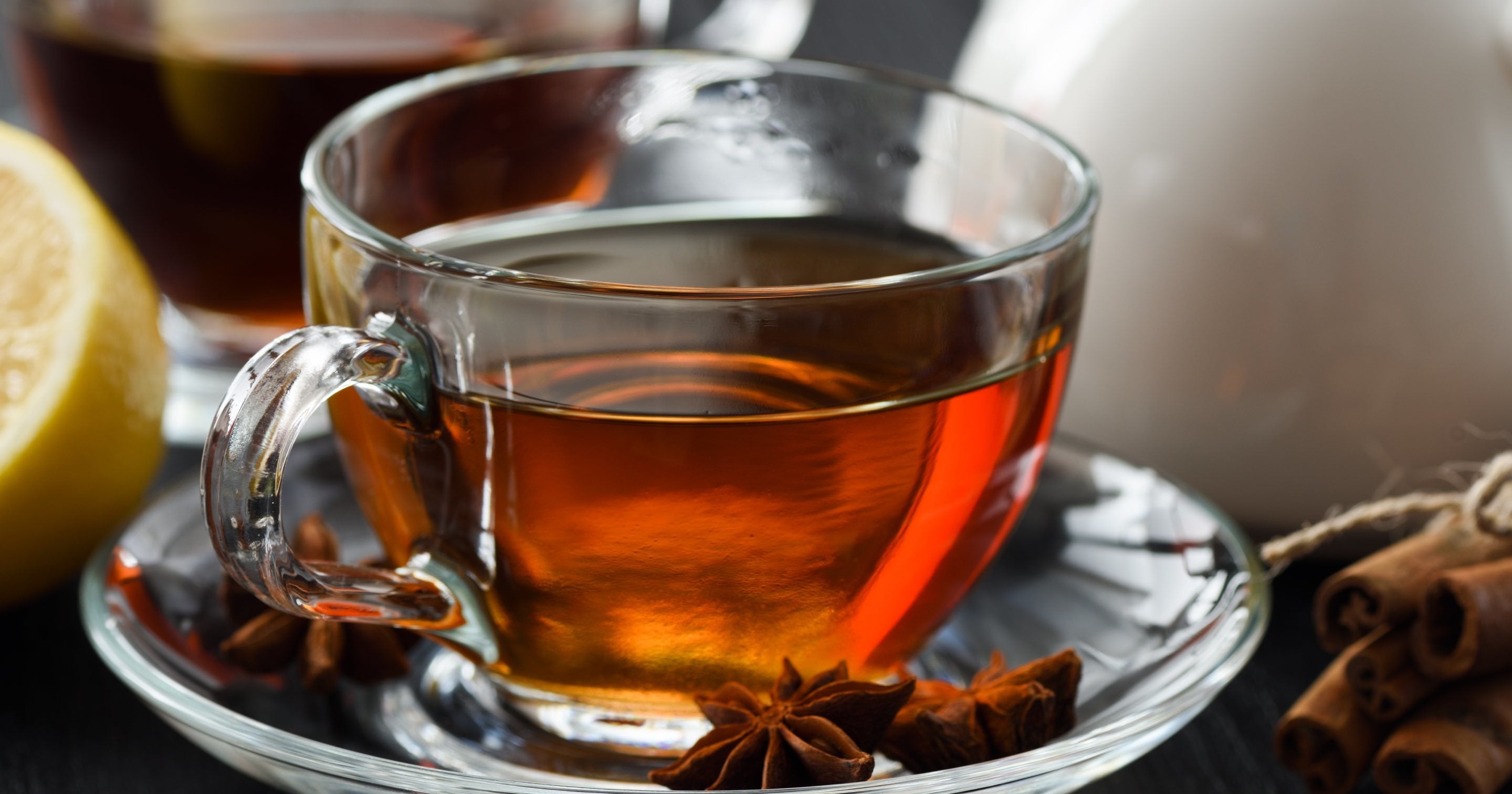 Glass cup and saucer of darjeeling tea