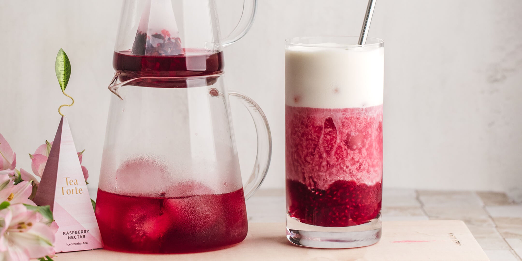 Raspberry Nectar Iced Tea with Cheese Foam in a glass.