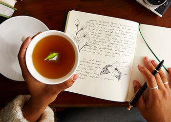 DOUBLE REWARDS WEEKEND - Holding a teacup with a book