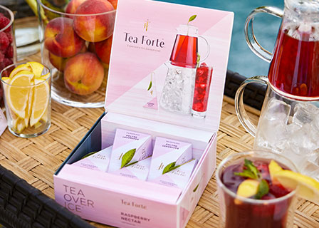 Raspberry Nectar iced tea five-pack opened beside a glass