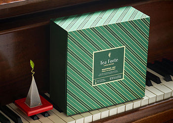 Warming Joy Tea Chest on piano