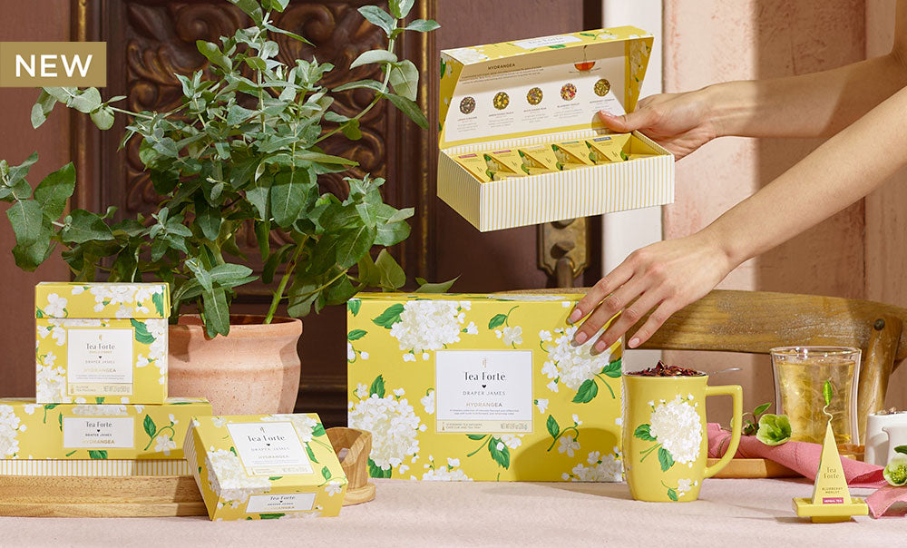 Hydrangea Collection items on a table with a woman
