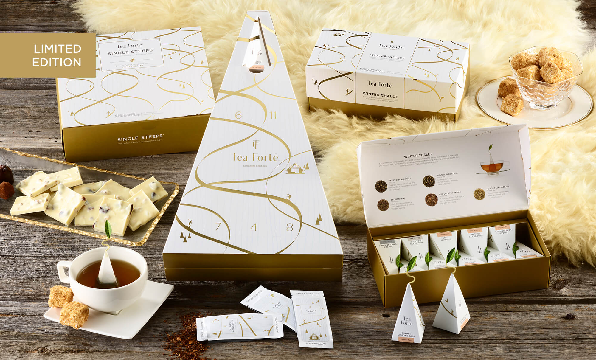 WINTER CHALET collection on a wooden table with white fur and white chocolate