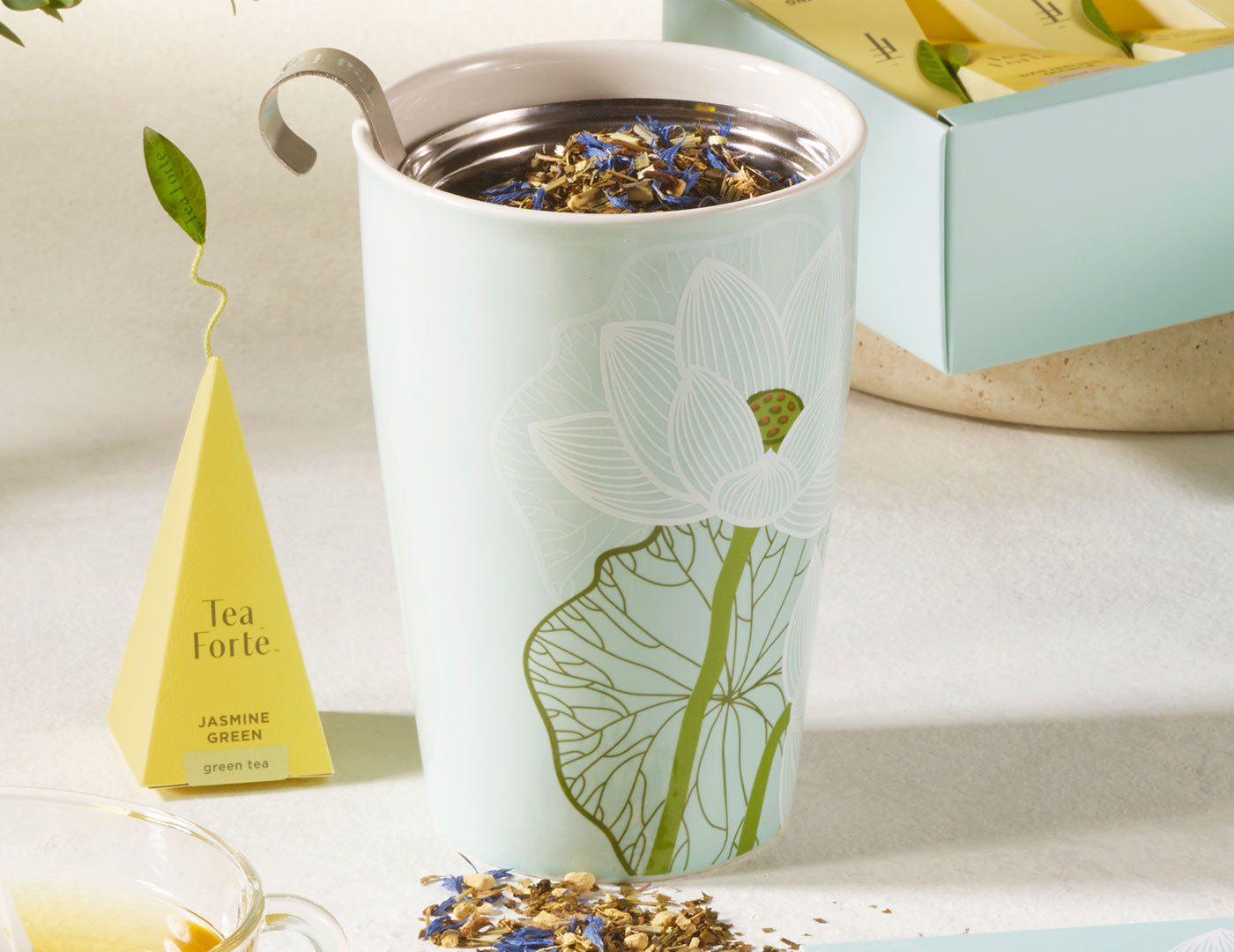 MAIN PDP |  Lotus design KATI® Steeping cup with infuser showing closeup of cup with loose tea inside
