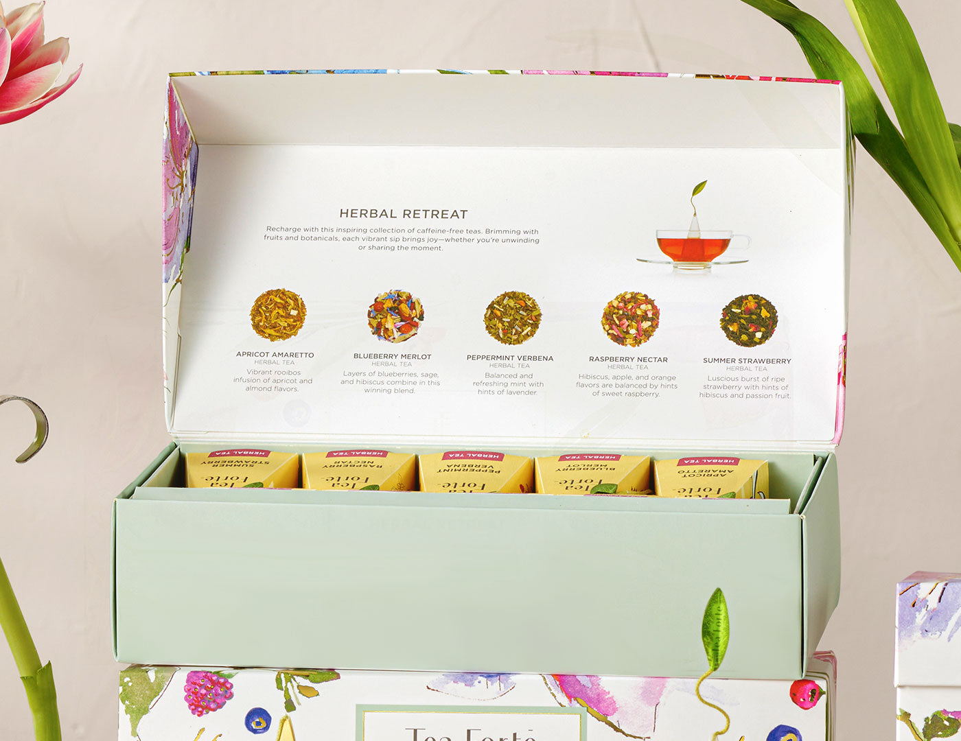 Herbal Retreat Petite Presentation Box, open, of 10 teas, on top of another box