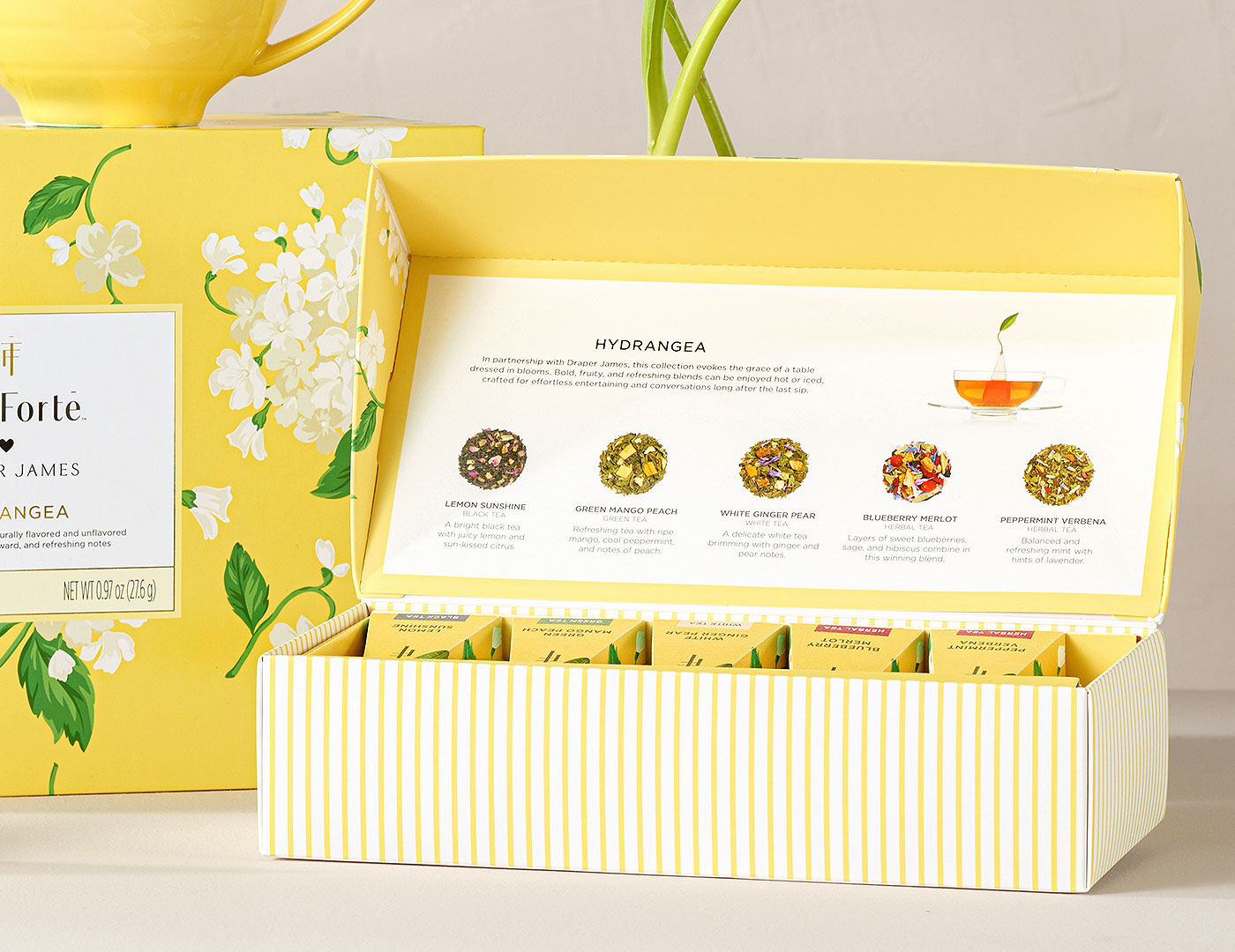 Hydrangea Petite Presentation Box, open, on a white table with other collection products in background