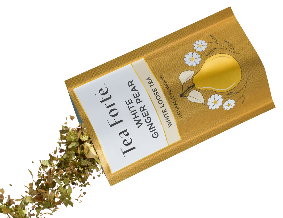 Tea Forte White Pear Ginger Single Steeps loose tea pouch pouring loose tea leaves on a white background