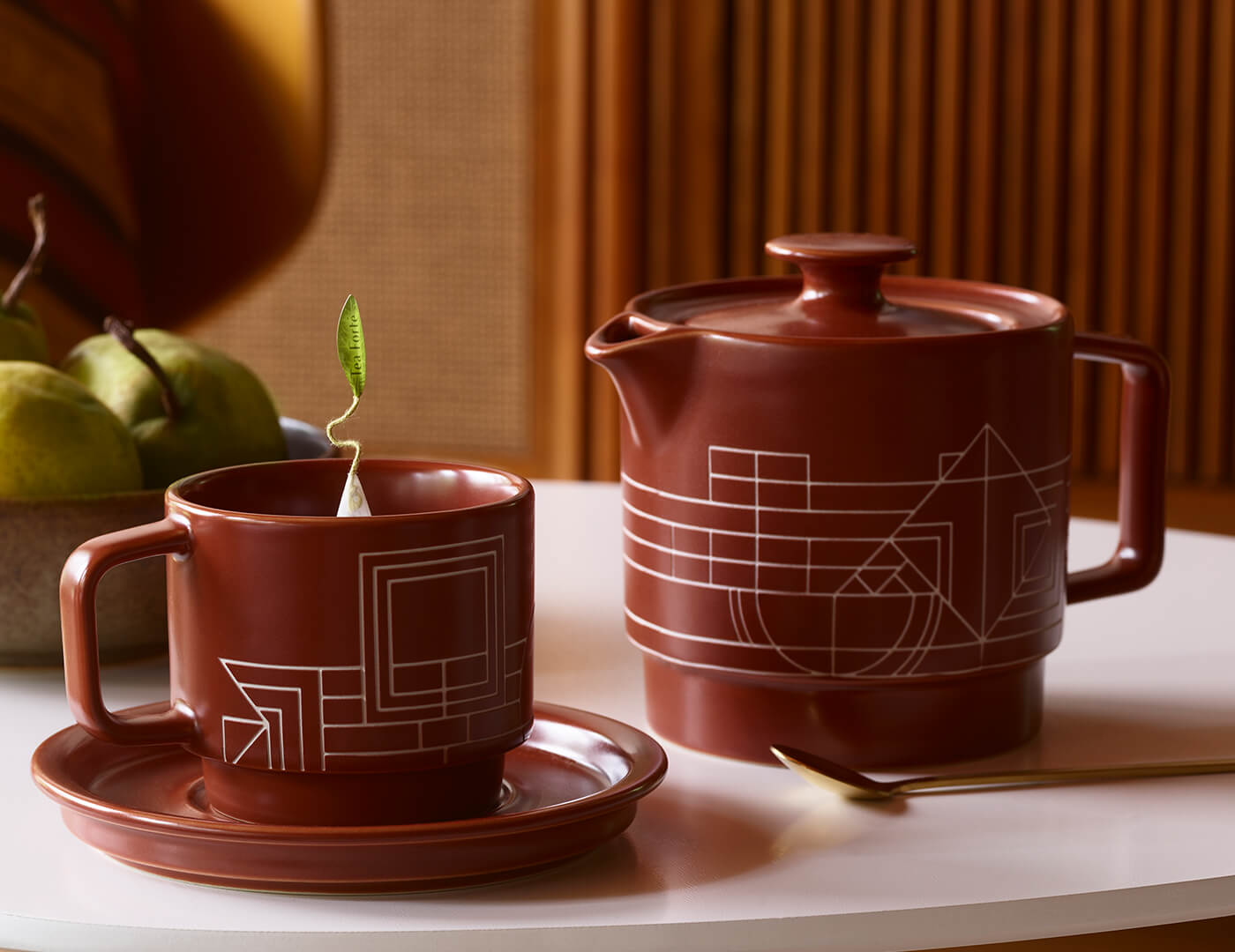 Terra Teacup, Saucer and Teapot together on a table