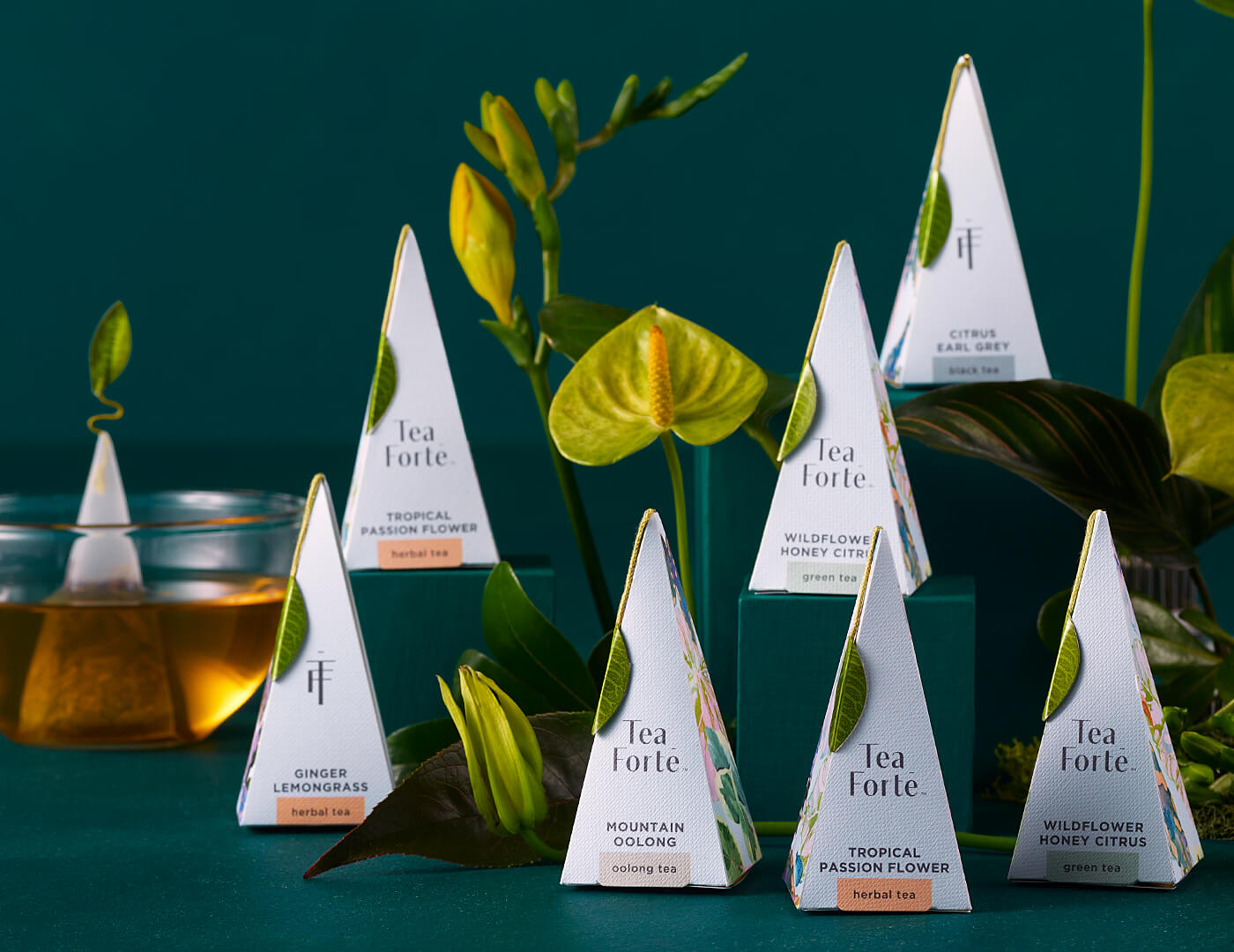 Closeup of Demoiselle pyramid infusers, amongst plants and flowers