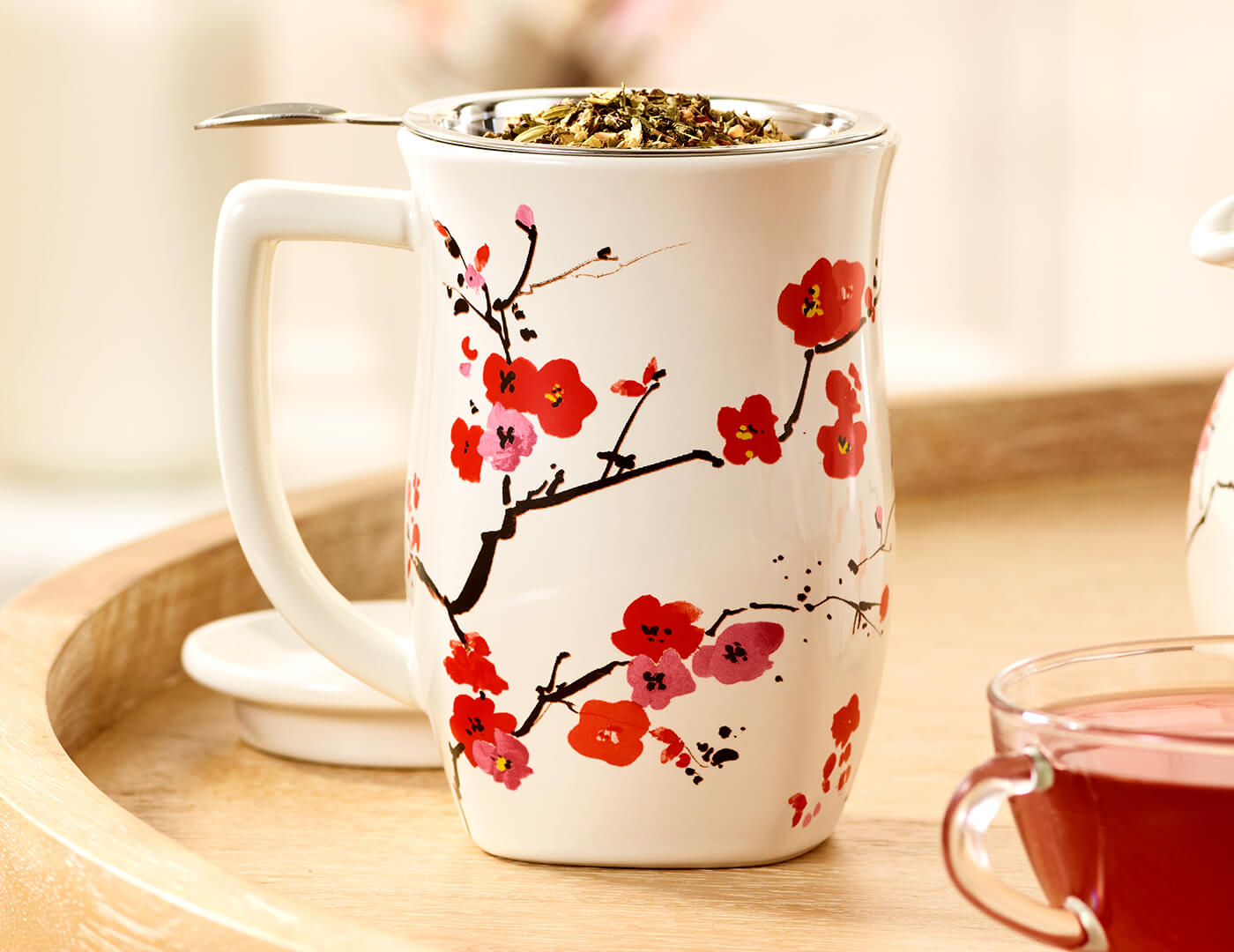 Fiore Sakura Steeping Cup with lid off and loose leaf tea inside the infuser