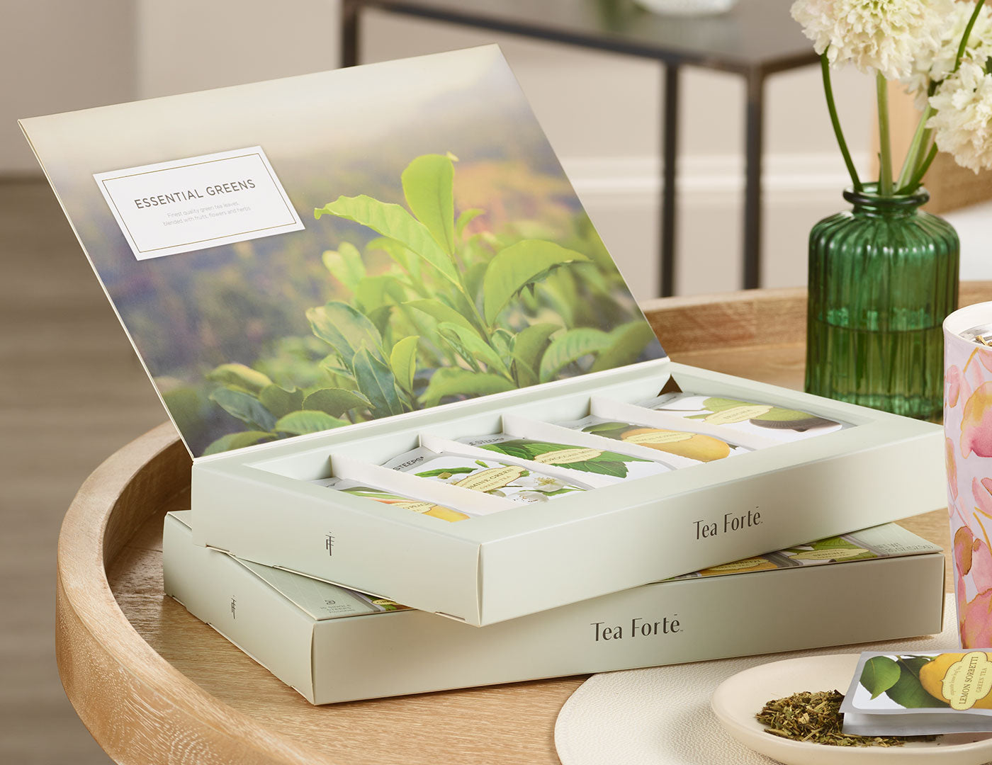 MAIN PDP | Essential Greens tea assortment 15 count box of Single Steeps pouches - open and stacked on another box