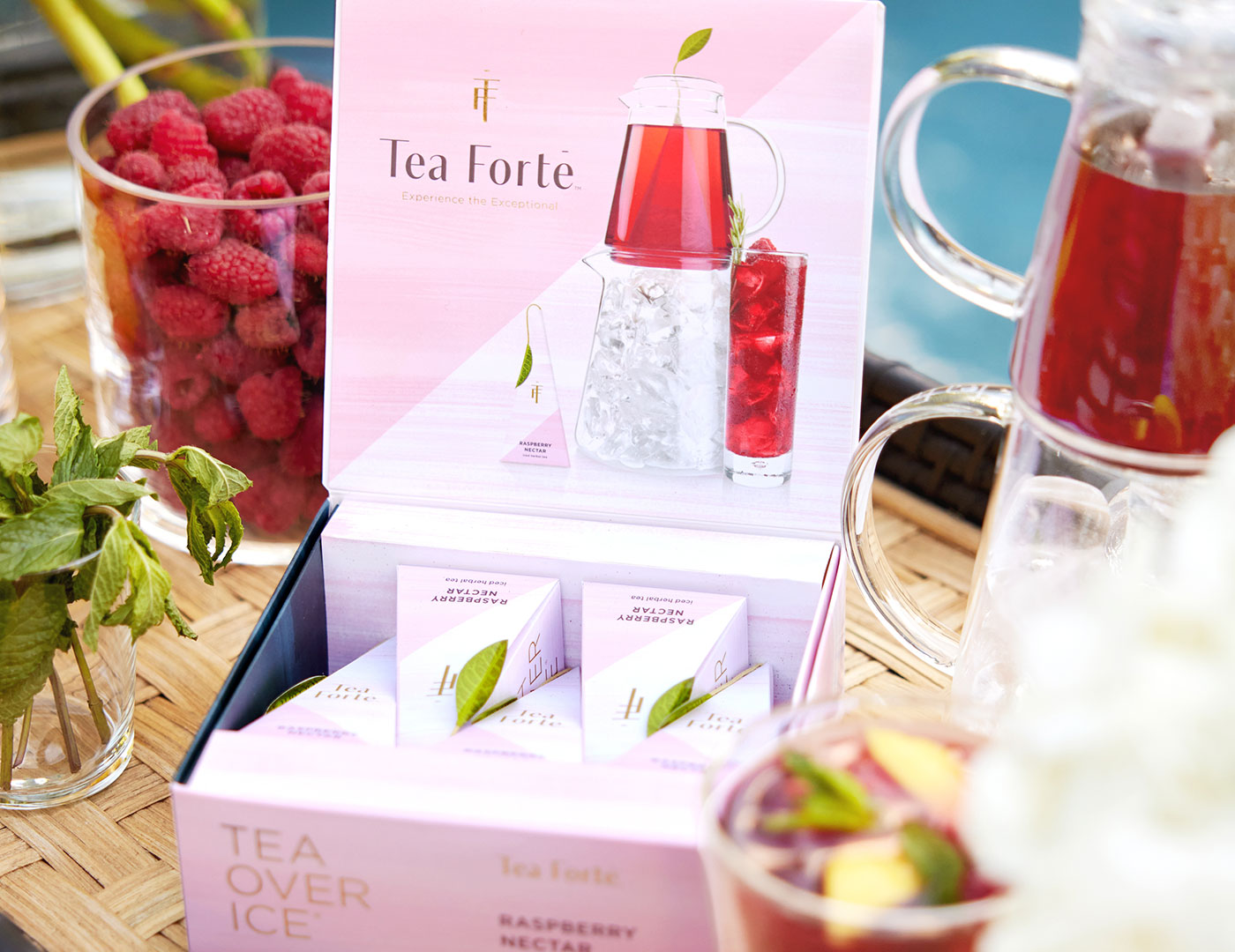 MAIN PDP | Tea Over Ice Raspberry Nectar 5pk open with iced tea and berries