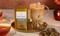 Tea Forté's Pumpkin Spice Loose Leaf Tea Canister with a glass of iced tea on a tray.

