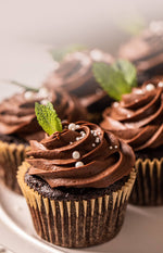 Belgian Mint Cupcakes with chocolate ganache frosting and mint leaves