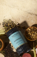 Defense Loose Tea Canister with tea and ingredients