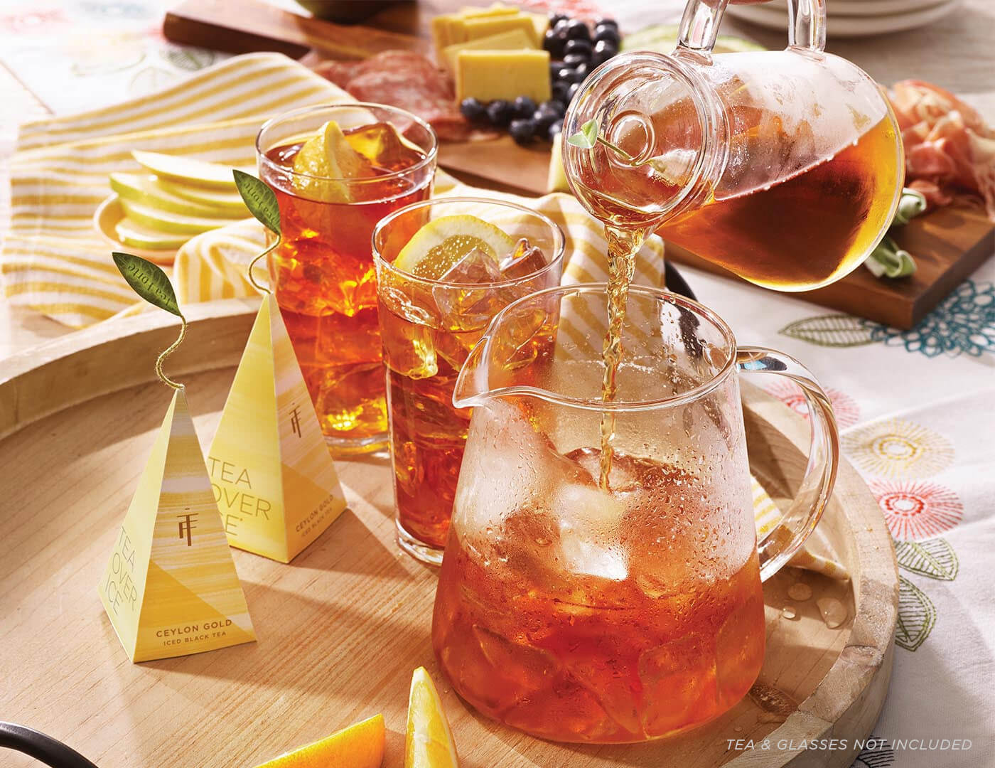 POuring steeped tea into a Tea Over Ice Pitcher Set