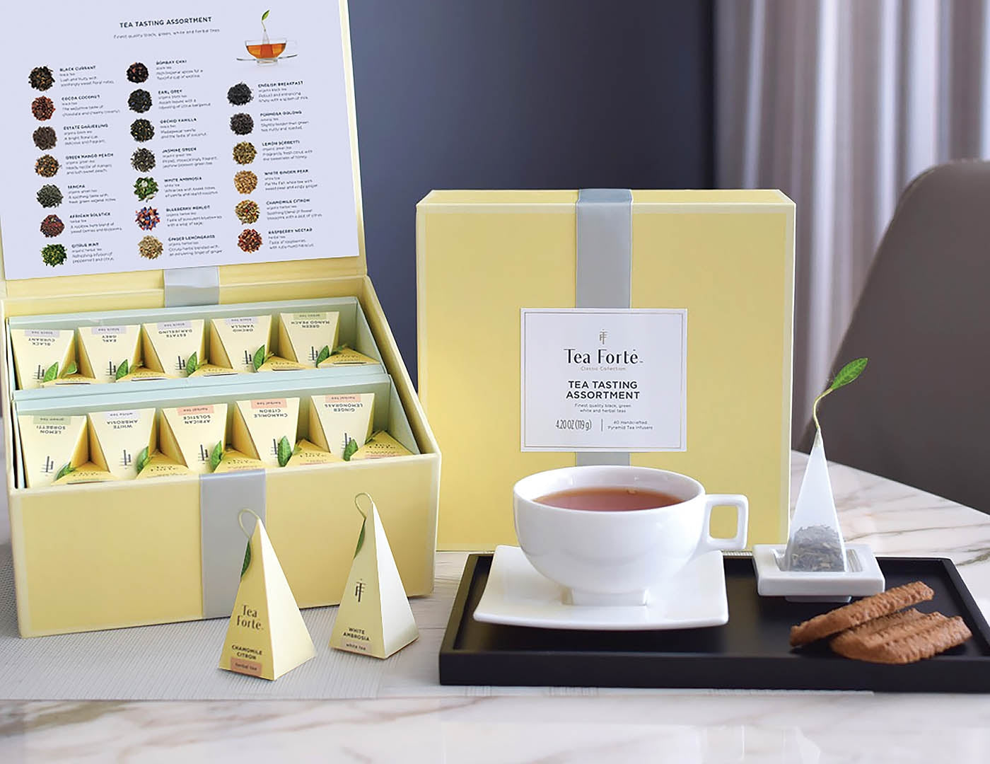 Tea Tasting tea assortment in a 40 count tea chest of pyramid infusers on table