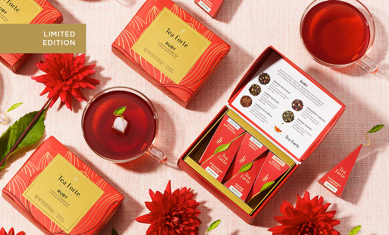 Ruby Tea Collection with glass cups , red flowers and infusers.