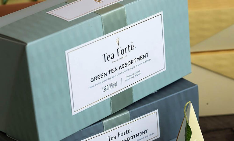 Green tea assortment in a 20 count presentation box on table