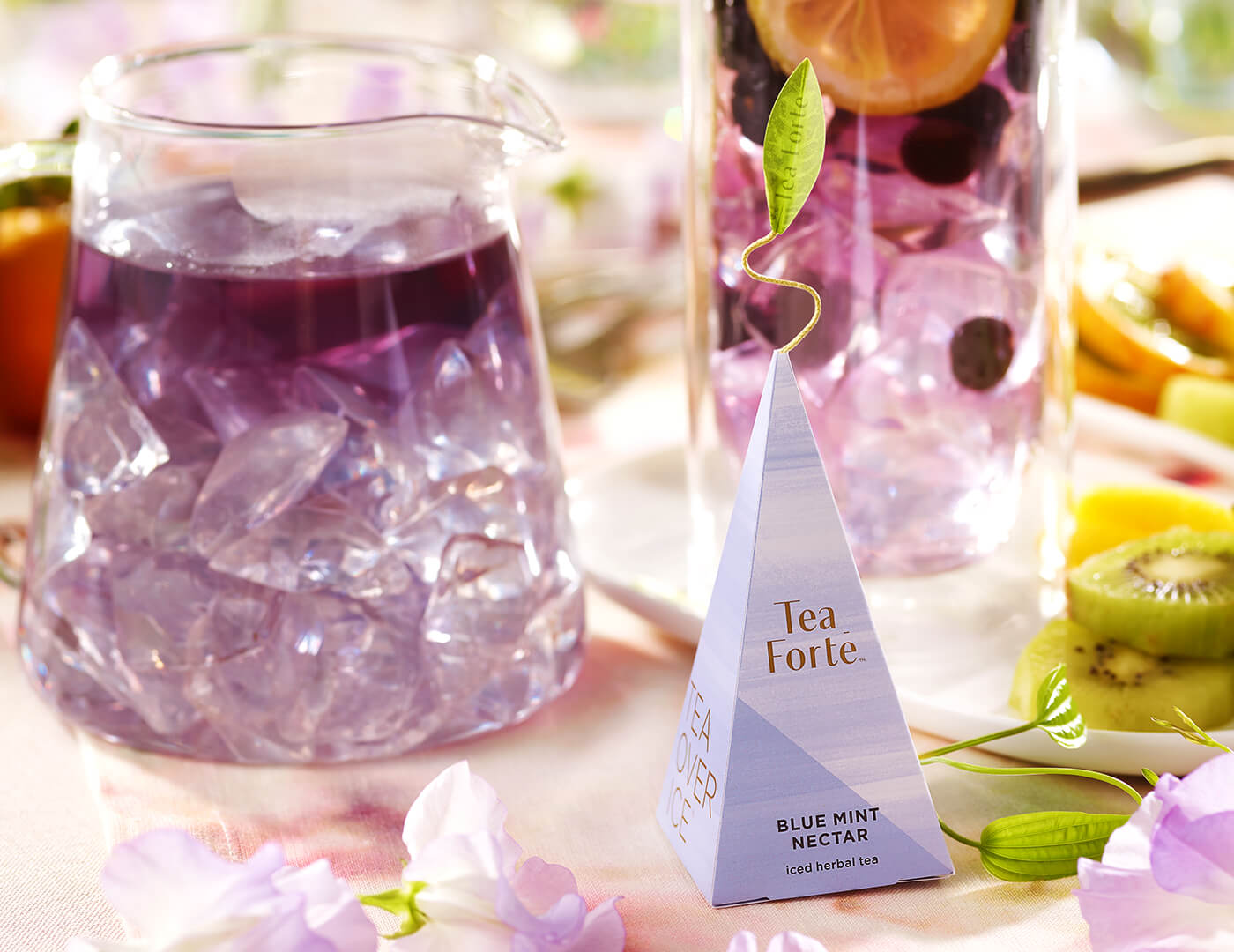 Blue Mint Nectar pyramid infuser with steeping iced tea in background