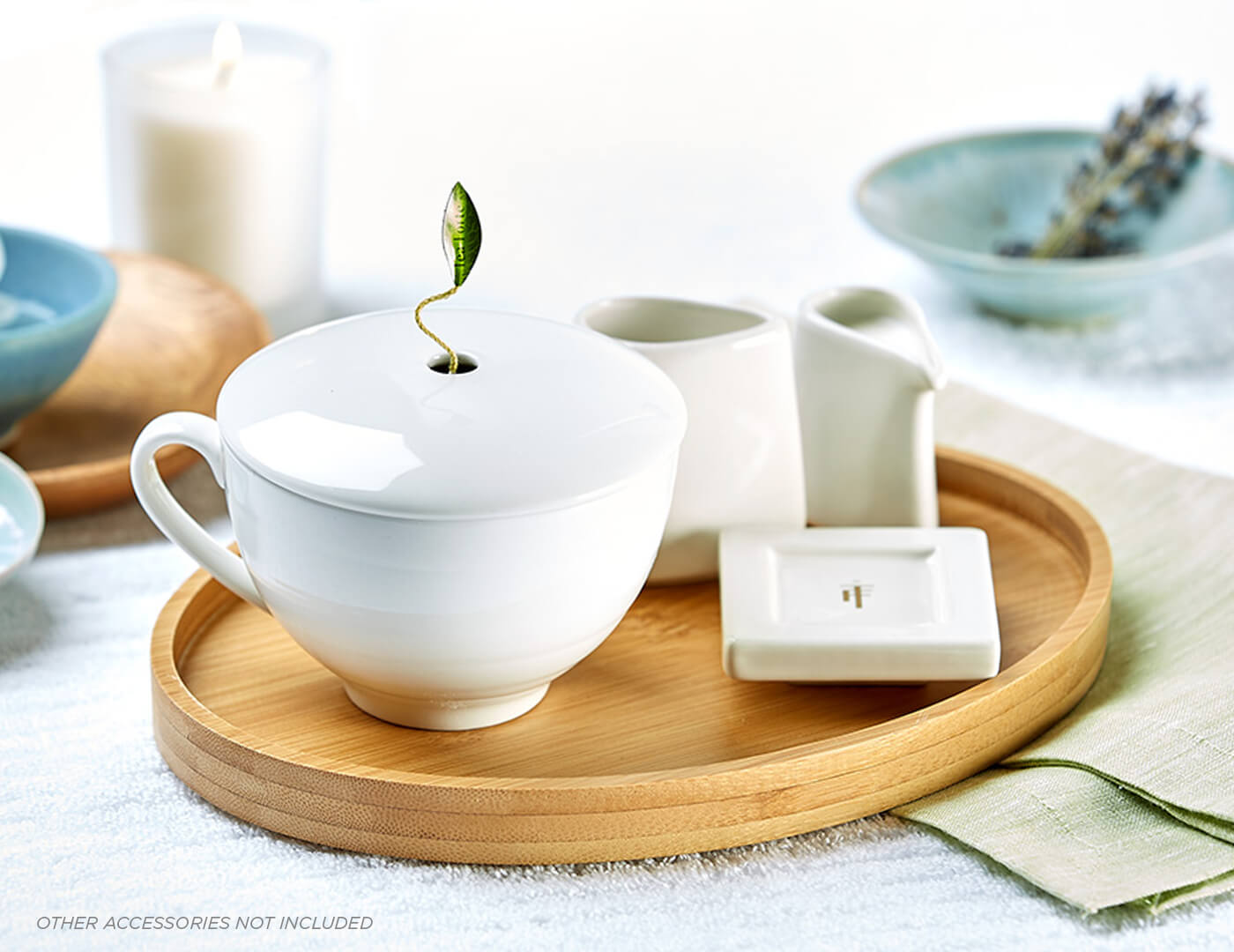 Café Cup with lid in a spa setting placed on a Bamboo Tray with a Tea Tray and Sugar & Creamer Set.
