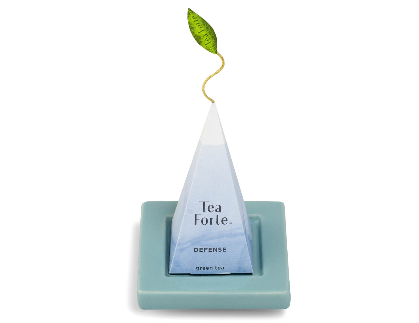 Wellbeing ceramic Tea Tray in blue with wrapped pyramid infuser sitting on top.